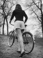 Bicycle Being Pushed by a Typical American Girl