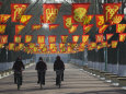 Bicycle Riders at Entranceway to Festival, Ice and Snow Festival, Harbin, Heilongjiang, China